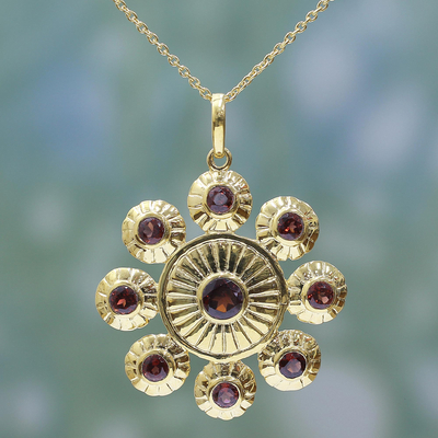 Gold plated garnet pendant necklace, 'Floral Brilliance' - Gold Plated Sterling Silver and Garnet Pendant Necklace
