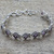 Amethyst tennis style bracelet, 'Purple Voyage' - Amethyst Sterling Silver Tennis Style Bracelet from India