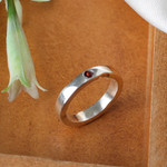 Garnet band ring, 'Curvy Sophistication in Red' - Sterling Silver and Garnet Band Ring from India