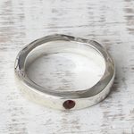 Garnet band ring, 'Curvy Sophistication in Red' - Sterling Silver and Garnet Band Ring from India
