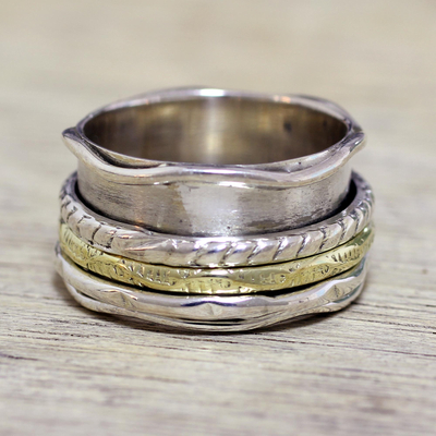 Sterling silver meditation spinner ring, 'Spinning Grace' - Handcrafted Sterling Silver and Brass Indian Spinner Ring
