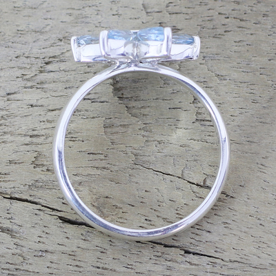 Blue topaz cocktail ring, 'Sparkling Daisy' - Blue Topaz and Sterling Silver Floral Ring from India