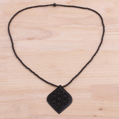 Ebony wood pendant necklace, 'Mughal Delight' - Beaded Ebony Wood Necklace with Hand Carved Leaf Pendant