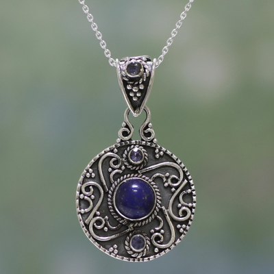 Lapis lazuli and blue topaz pendant necklace, 'Swirling Harmony' - Lapis Lazuli and Blue Topaz Pendant Necklace from India