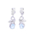 Rhodium plated blue topaz dangle earrings, 'Blue Swirl' - Rhodium Plated Blue Topaz Dangle Earrings from India