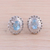 Rhodium plated blue topaz button earrings, 'Radiant Rays' - Rhodium Plated Blue Topaz Button Earrings from India