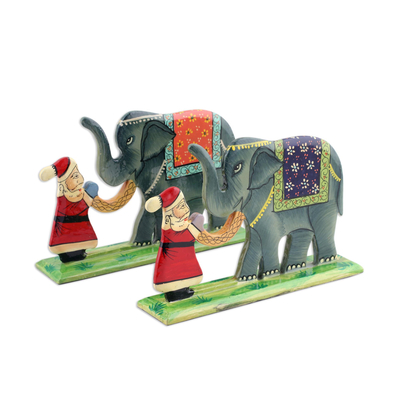 Wood decorative accents, 'Jungle Santa' (pair) - Hand Painted Christmas Decor with Santa and Elephants (Pair)