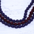 Mehrsträngige, mit Stoff umwickelte Perlenkette - Indische mehrsträngige, mit Stoff umwickelte Perlenkette in Lila