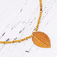 Wood pendant necklace, 'Mulberry Leaf' - Hand Carved Wood Beaded Leaf Pendant Necklace