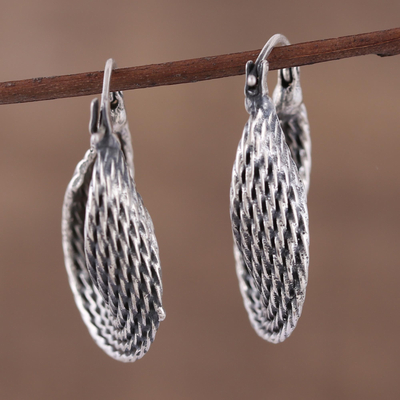 Sterling silver hoop earrings, 'Turn Around' - Unique Sterling Silver Hoop Earrings with Twist Design