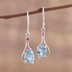 Rhodium plated blue topaz and ruby dangle earrings, 'Enthralling Sky' - Indian Blue Topaz and Ruby Sterling Silver Dangle Earrings