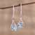 Rhodium plated blue topaz and ruby dangle earrings, 'Enthralling Sky' - Indian Blue Topaz and Ruby Sterling Silver Dangle Earrings (image 2) thumbail