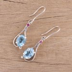 Rhodium plated blue topaz and ruby dangle earrings, 'Enthralling Sky' - Indian Blue Topaz and Ruby Sterling Silver Dangle Earrings