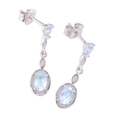Rhodium plated blue topaz dangle earrings, 'Glacial Luster' - Blue Topaz Rhodium Plated Sterling Silver Dangle Earrings