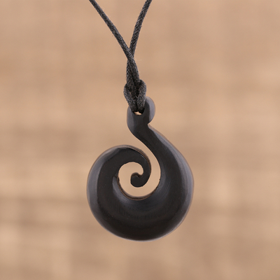 Ebony wood pendant necklace, 'Curling Wave' - Hand Carved Ebony Wood Swirl Motif Pendant Necklace