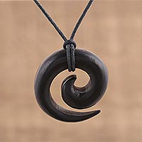 Ebony wood pendant necklace, 'Captivating' - Hand Carved Ebony Wood Spiral Motif Pendant Necklace