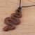 Ebony wood pendant necklace, 'Serpent's Twist' - Hand Carved Ebony Wood Snake Pendant Necklace