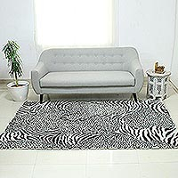Hand-tufted wool area rug, 'Wild Harmony' - Zebra and Leopard Black and White Hand Tufted Wool Area Rug