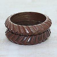 Wood bangle bracelets, 'Dimensions' (pair) - Hand Carved Angles Wood Bangle Bracelets from India (Pair)