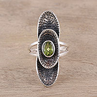 Peridot cocktail ring, 'Oval Fantasy' - Sterling Silver Oval Faceted Green Peridot Cocktail Ring