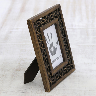 Wood photo frame, 'Interlinked' (4x6) - Wood Hand Carved Cutouts Rectangular Photo Frame (4x6)