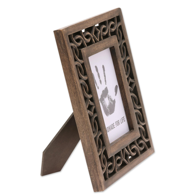 Wood photo frame, 'Interlinked' (4x6) - Wood Hand Carved Cutouts Rectangular Photo Frame (4x6)