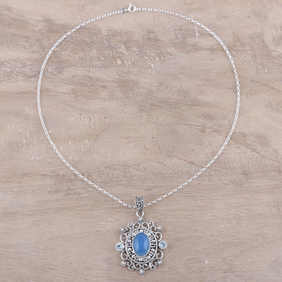 Blue topaz and chalcedony pendant necklace, 'Glowing Heaven' - Blue Topaz and Chalcedony Pendant Necklace from India