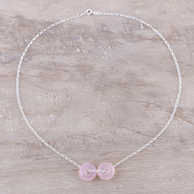 Rose quartz pendant necklace, 'Delightful Duet' - Rose Quartz Double Disc and Sterling Silver Pendant Necklace