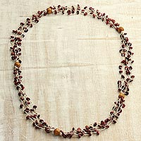 Wood torsade necklace, 'Burgundy Pebbles' - Burgundy Haldu Wood Woven Beaded Long Torsade Necklace