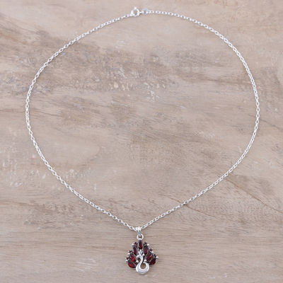 Garnet pendant necklace, 'Dazzling Plumage' - Peacock-Themed Garnet Pendant Necklace from India