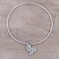 Sterling silver bangle bracelet, 'Content Heart' - Sterling Silver Heart Charm Bangle Bracelet from India