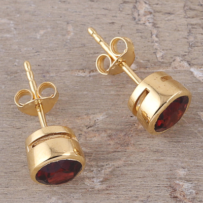 Gold plated garnet stud earrings, 'Sparkling World' - Handcrafted 22k Gold Plated Faceted Garnet Stud Earrings