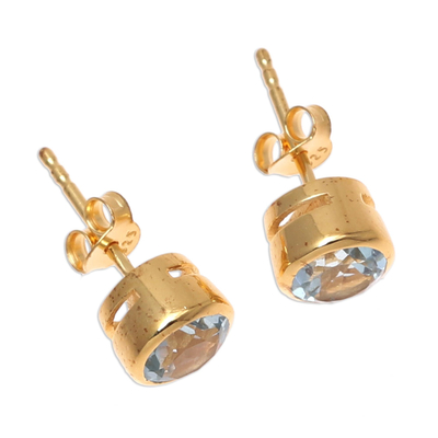 Gold plated blue topaz stud earrings, 'Sparkling World' - 22k Gold Plated Faceted Blue Topaz Stud Earrings from India