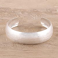 Sterling silver cuff bracelet, 'Glimmering Charm' - Brushed-Satin Sterling Silver Cuff Bracelet from India