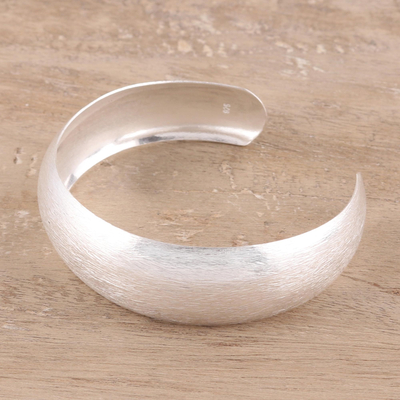 Sterling silver cuff bracelet, 'Glimmering Charm' - Brushed-Satin Sterling Silver Cuff Bracelet from India