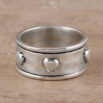 Sterling silver spinner ring, 'Mesmerizing Hearts' - Heart Motif Sterling Silver Spinner Ring from India