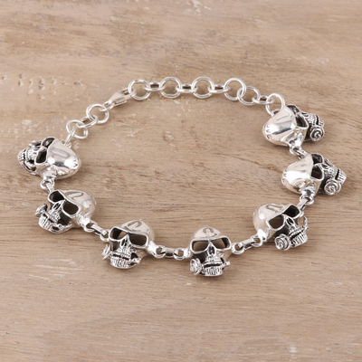 Men's sterling silver link bracelet, 'Suave Skulls' - Men's Sterling Silver Skull Link Bracelet from India