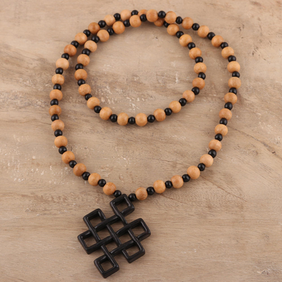 Ebony wood beaded pendant necklace, 'Eternal Knot' - Ebony Wood Beaded Pendant Necklace from India