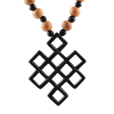 Ebony wood beaded pendant necklace, 'Eternal Knot' - Ebony Wood Beaded Pendant Necklace from India