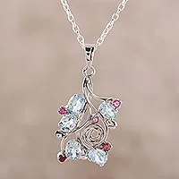 Rhodium plated blue topaz and ruby pendant necklace, 'Delightful Berries' - Rhodium Plated Blue Topaz and Ruby Pendant Necklace