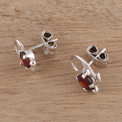 Rhodium plated garnet stud earrings, 'Blissful Radiance' - Leafy Rhodium Plated Garnet Stud Earrings from India