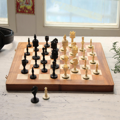Bone and wood travel chess set, 'Castles Clash' - Hand-Carved Bone and Wood Travel Chess Set from India