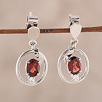 Rhodium plated garnet dangle earrings, 'Oval Glitter' - Rhodium Plated Oval Garnet Dangle Earrings from India