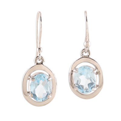 Rhodium plated blue topaz dangle earrings, 'Oval Sparkle' - Rhodium Plated Oval Blue Topaz Dangle Earrings from India