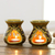 Ceramic oil warmers, 'Floral Aroma' (pair) - Amber Floral Motif Ceramic Oil Warmers from India (Pair)