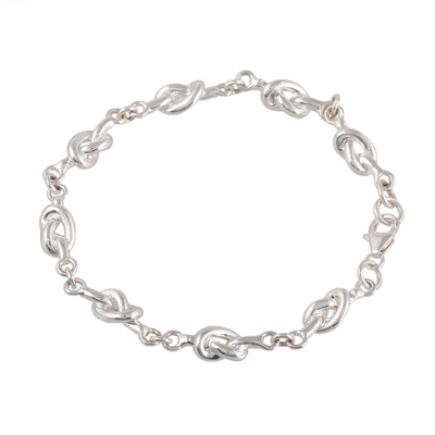 Sterling silver link bracelet, 'Glistening Knots' - Knot Pattern Sterling Silver Link Bracelet from India