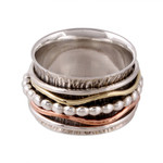 Sterling silver spinner ring, 'Dotted Flair' - Patterned Sterling Silver Spinner Rig with Brass and Copper