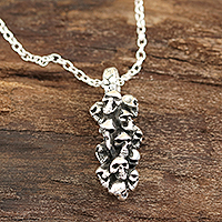 Sterling silver pendant necklace, 'Skull Cluster' - Sterling Silver Skull Pendant Necklace from India