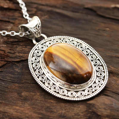 Tiger's eye pendant necklace, 'Dancing Earth' - Oval Tiger's Eye Pendant Necklace from India