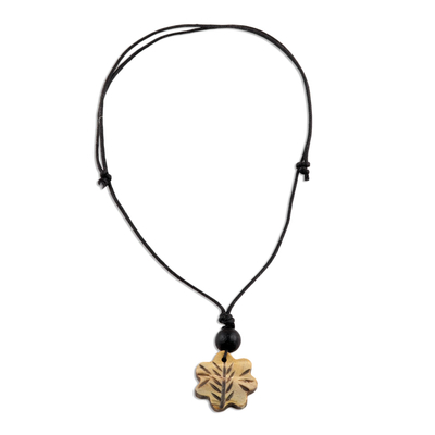 Hand-carved pendant necklace, 'Floral Glory' - Floral Pendant Necklace from India